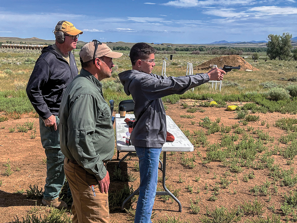 Under the watchful eyes of his Dad, Garrett Trevino verifies the sight settings on a Bobbie Tyler customized Ruger Super Bearcat for the day’s outing. A little extra tutelage from Gunsite Rangemaster Lew Gosnell (left) paid dividends once the trio hit the open prairie.